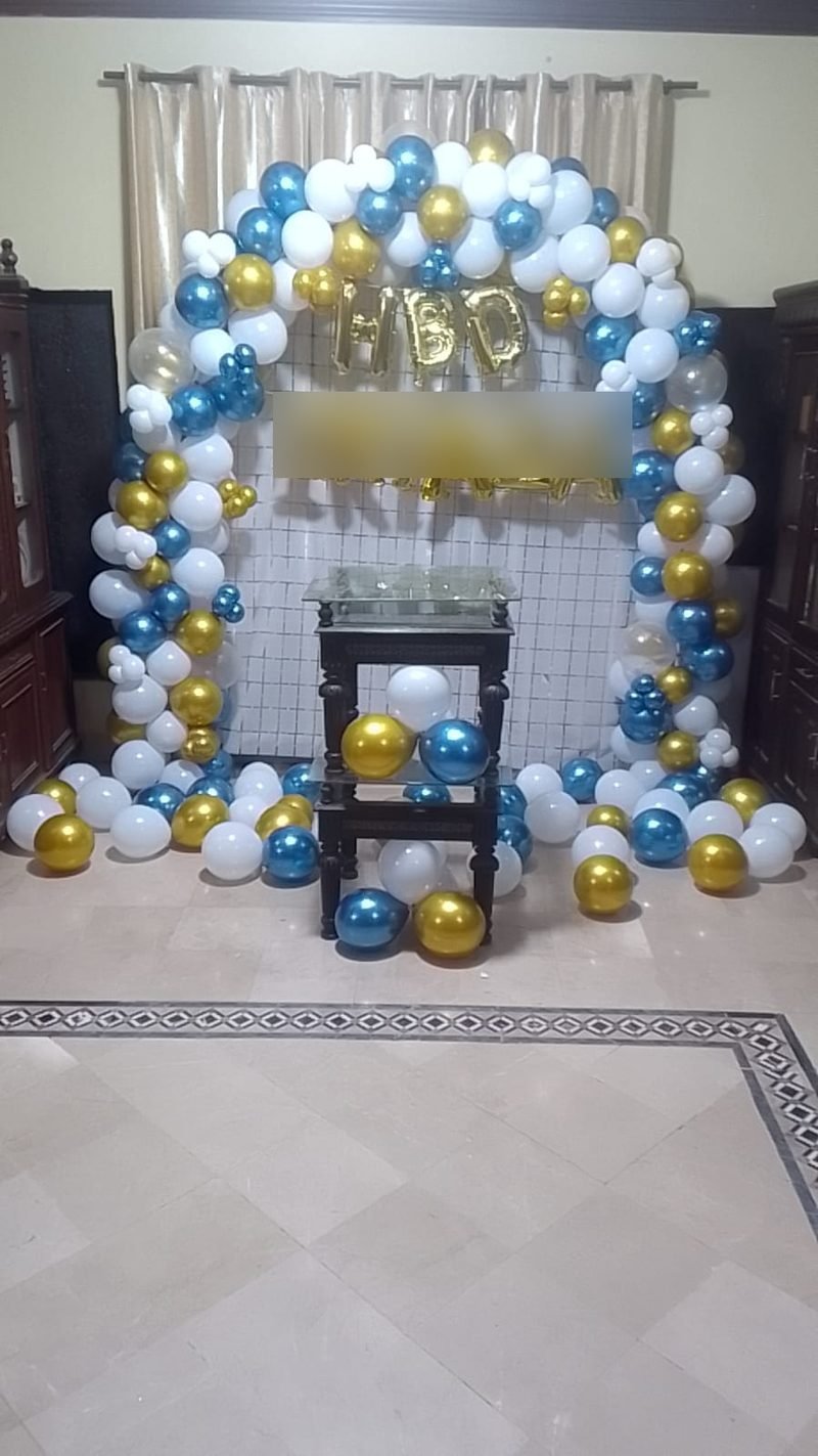 Blue, white and gold balloon ring with a shimmer wall and cake table – Events In Sialkot