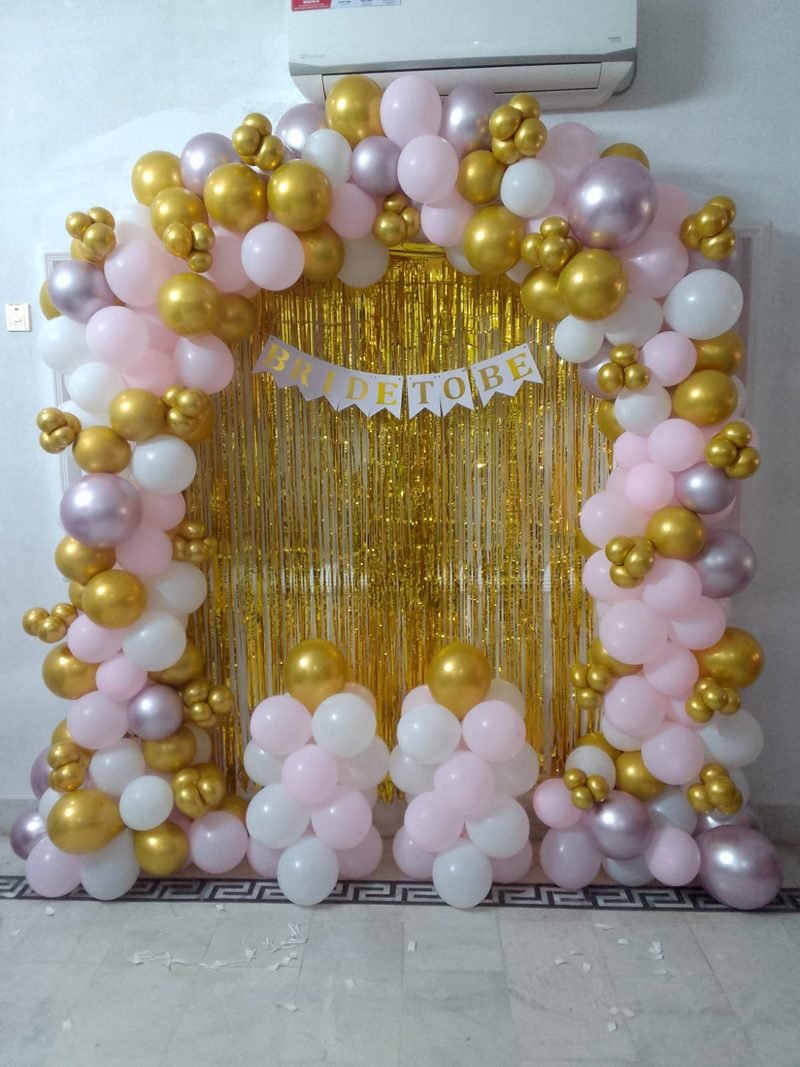 Pink, white and gold balloon arch with a gold foil curtain and Bride To Be banner – Events In Sialkot