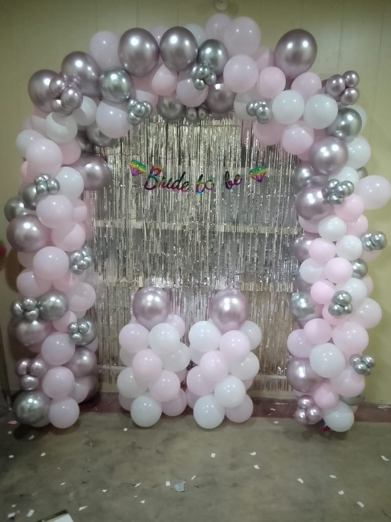 Pink and silver balloon arch with a silver foil curtain and Bride to be banner – Events In Sialkot