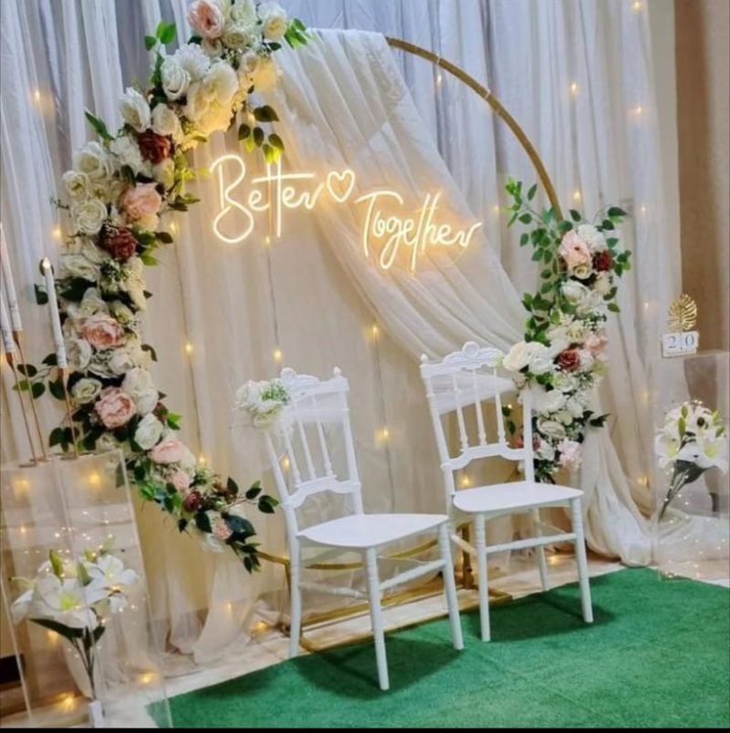 Engagement setup with a gold ring, white flowers and a Better Together neon sign – Events In Sialkot