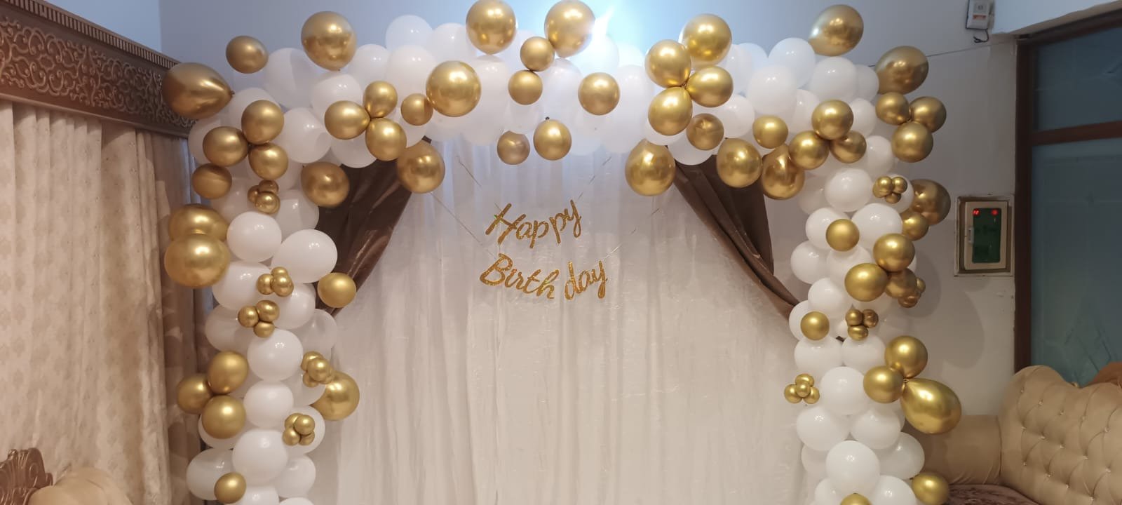 Orange and white birthday balloon decoration in Sialkot – Events In Sialkot