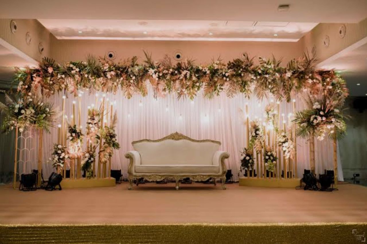 Orange floral backdrop decor with fairy lights in Sialkot – Events In Sialkot