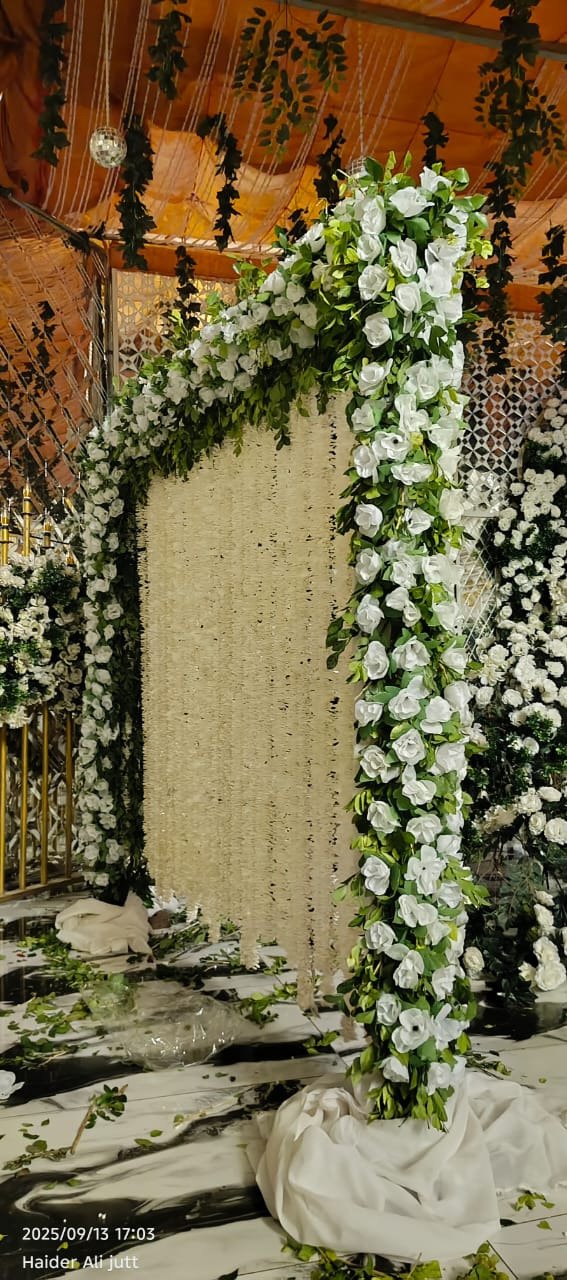 Orange and green floral backdrop decor with fairy lights in Sialkot – Events In Sialkot