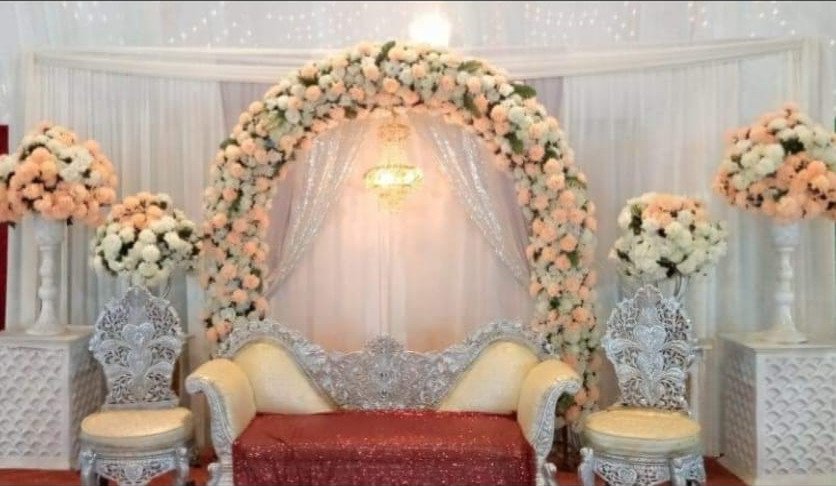 White and orange floral backdrop decor with fairy lights in Sialkot – Events In Sialkot
