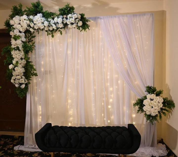 Orange floral backdrop decor with fairy lights in Sialkot – Events In Sialkot