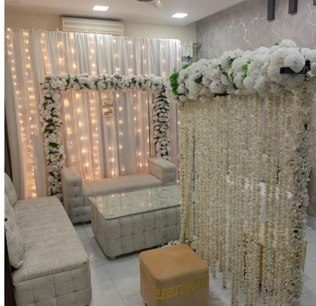 White and orange floral backdrop decor with fairy lights in Sialkot – Events In Sialkot