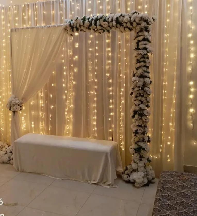 Orange floral backdrop decor with fairy lights in Sialkot – Events In Sialkot