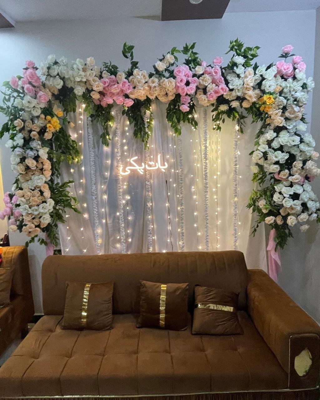 Orange and gold floral backdrop decor with fairy lights in Sialkot – Events In Sialkot