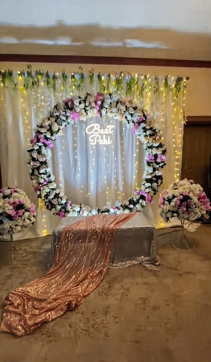 Orange and gold floral backdrop decor with fairy lights in Sialkot – Events In Sialkot