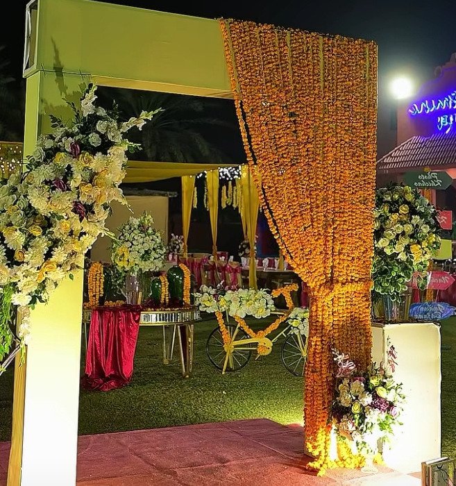 Gold and orange floral backdrop decor with fairy lights in Sialkot – Events In Sialkot