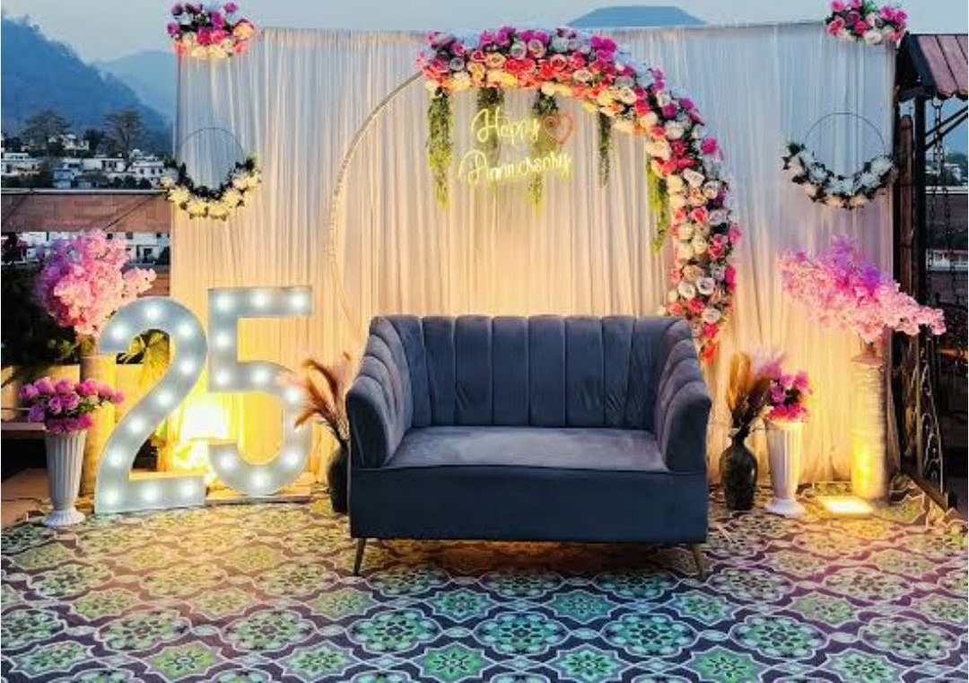Orange floral backdrop decor with fairy lights in Sialkot – Events In Sialkot