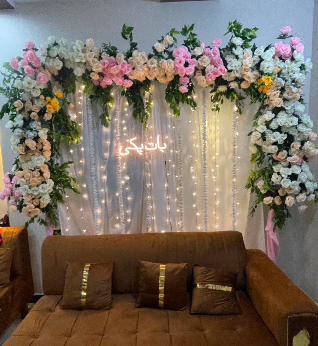 Orange and gold floral backdrop decor with fairy lights in Sialkot – Events In Sialkot