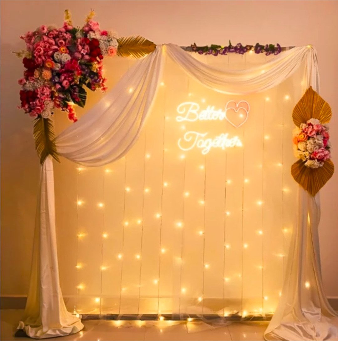 Orange floral backdrop decor with fairy lights in Sialkot – Events In Sialkot