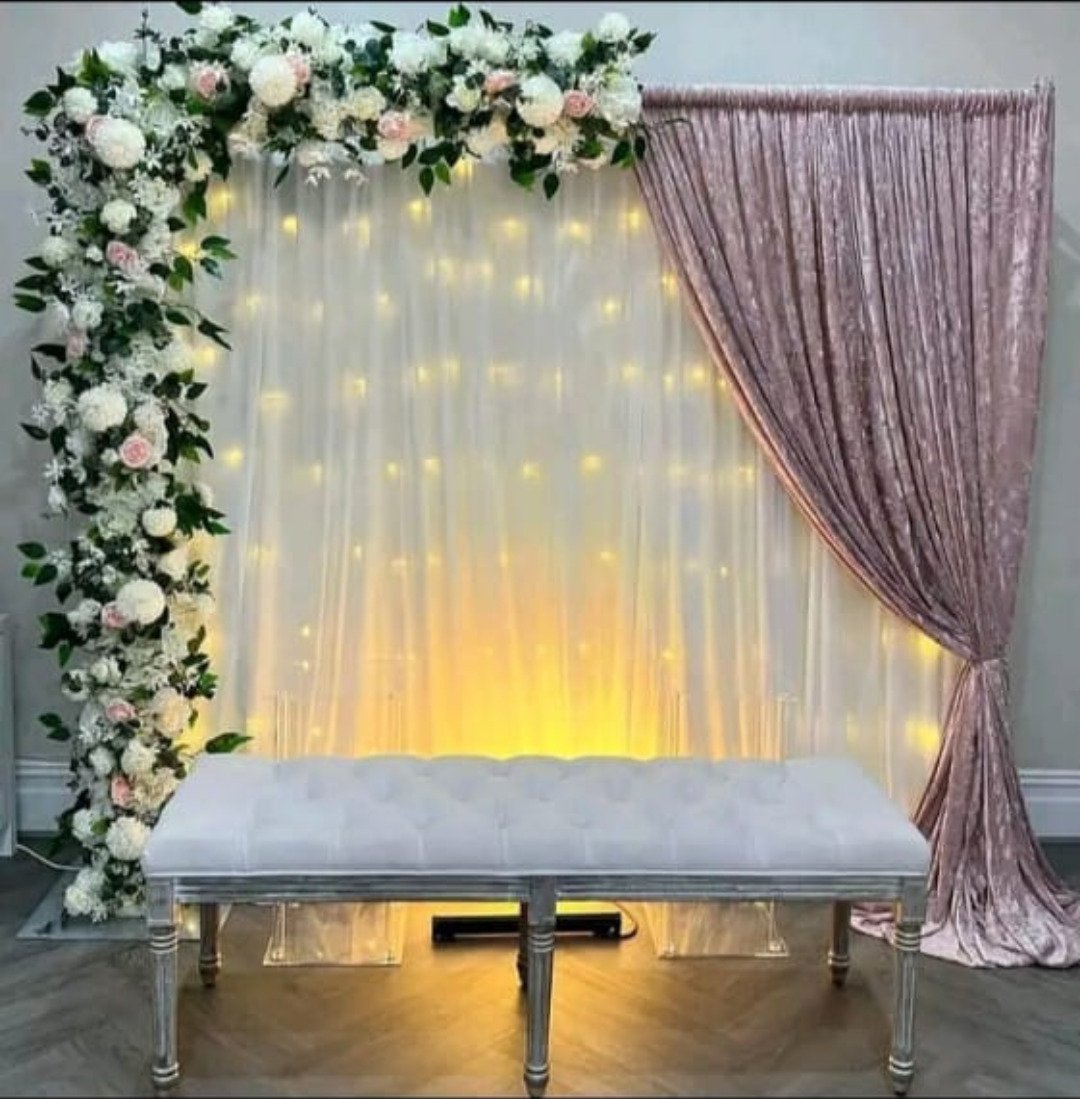 Orange and white floral backdrop decor with fairy lights in Sialkot – Events In Sialkot