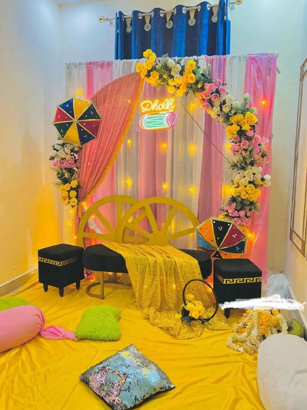 Mehndi or mayun stage with marigold drapes, fairy lights and a sofa in Sialkot – Events In Sialkot