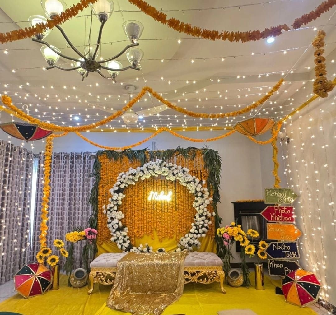 Orange and gold mehndi stage decoration in Sialkot – Events In Sialkot