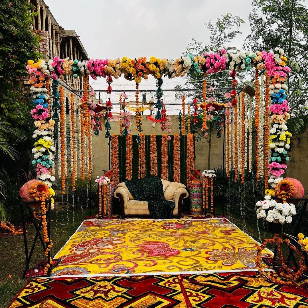 Orange and white mehndi stage decoration in Sialkot – Events In Sialkot