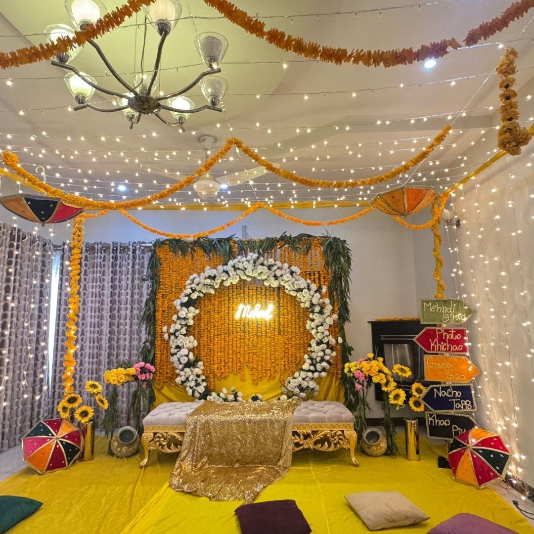Gold and orange mehndi stage decoration in Sialkot – Events In Sialkot