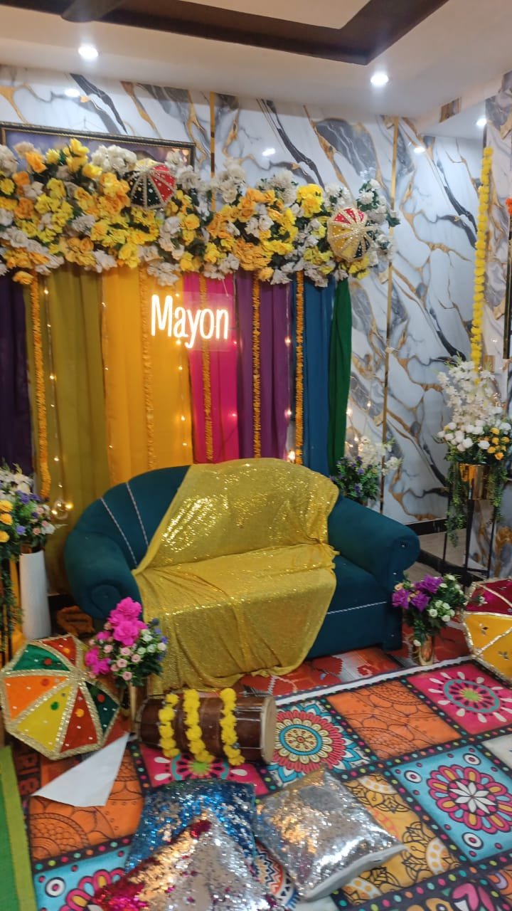 Gold and orange mehndi stage decoration in Sialkot – Events In Sialkot