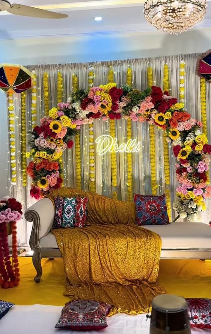 Gold and orange mehndi stage decoration in Sialkot – Events In Sialkot