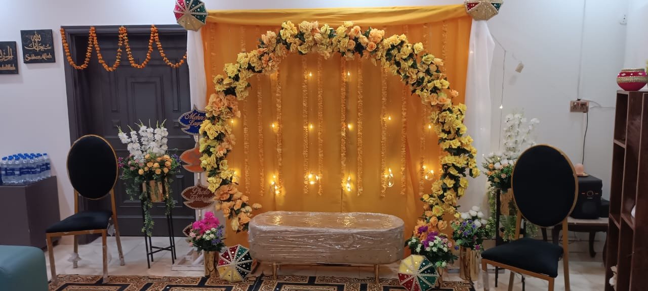 Orange mehndi stage decoration in Sialkot – Events In Sialkot