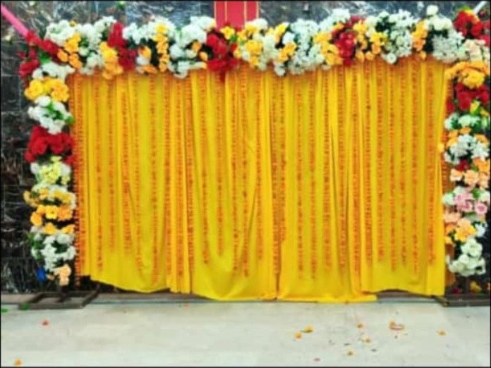 Gold and orange mehndi stage decoration in Sialkot – Events In Sialkot