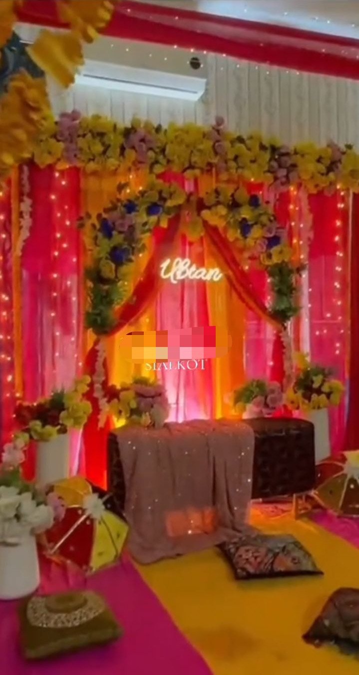 Red and orange mehndi stage decoration in Sialkot – Events In Sialkot