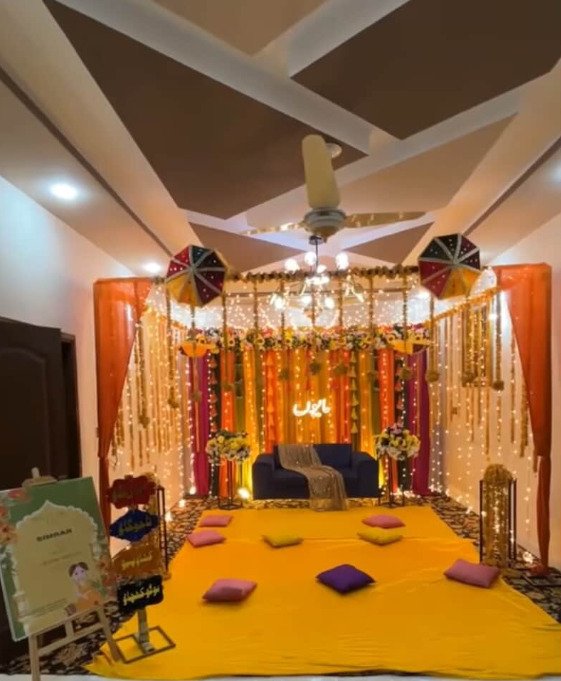 Orange mehndi stage decoration in Sialkot – Events In Sialkot