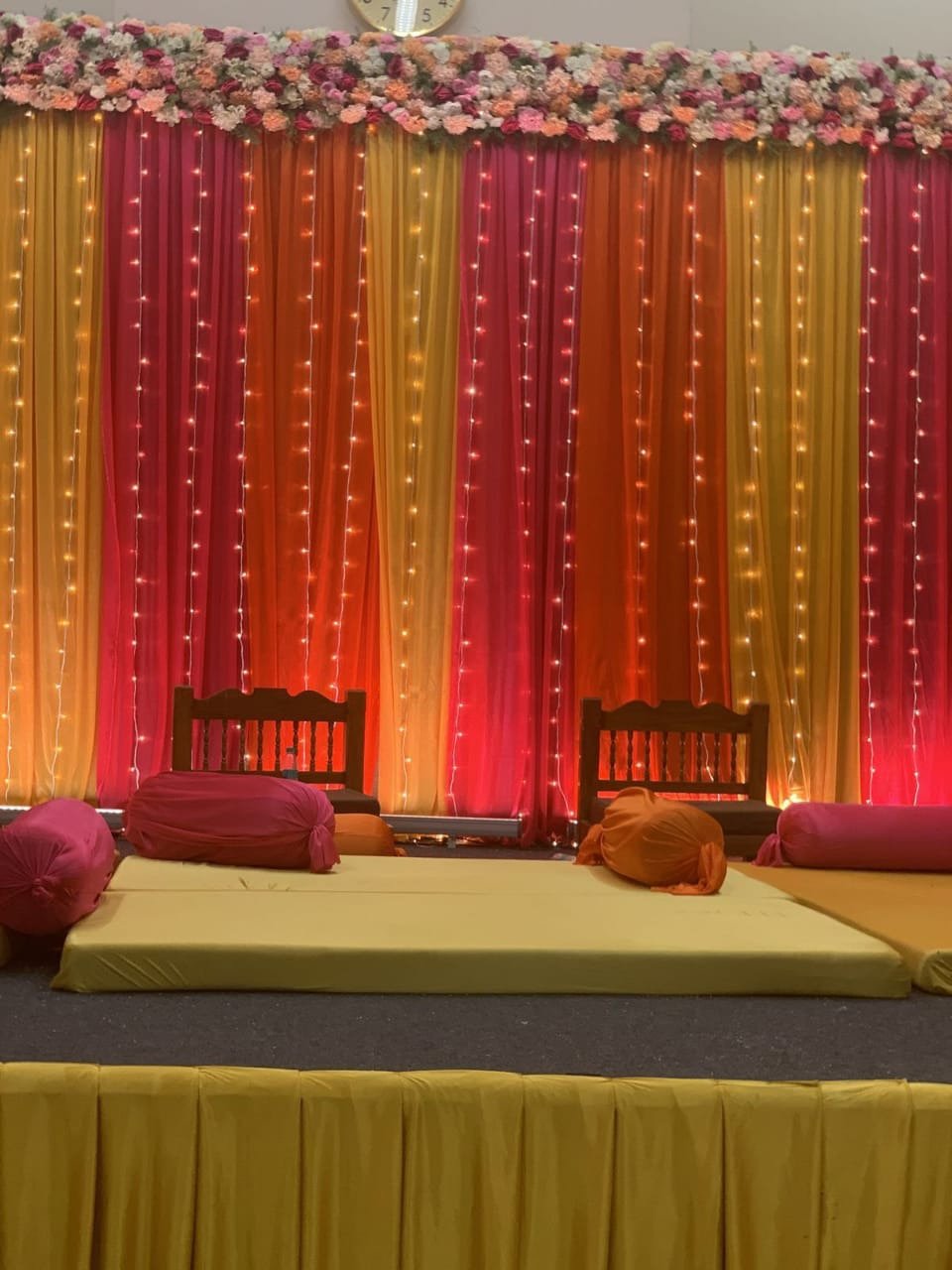 Gold and orange mehndi stage decoration in Sialkot – Events In Sialkot