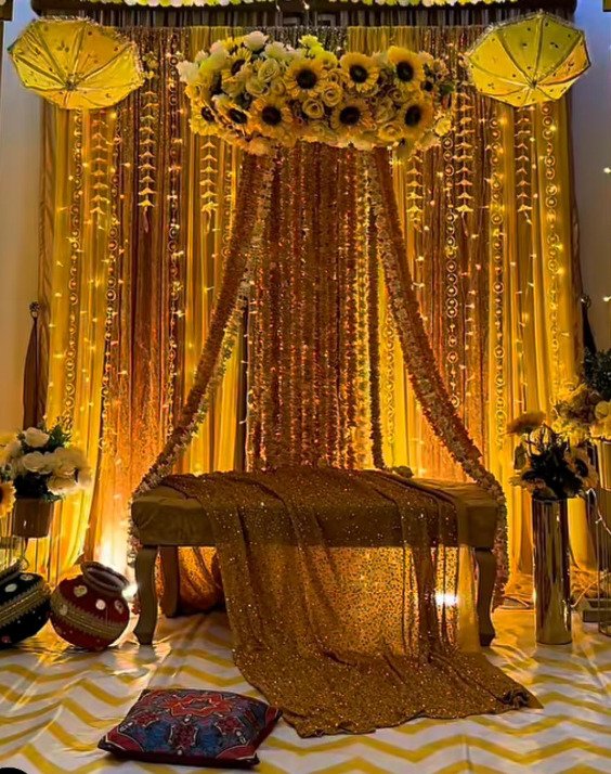 Orange and gold mehndi stage decoration in Sialkot – Events In Sialkot