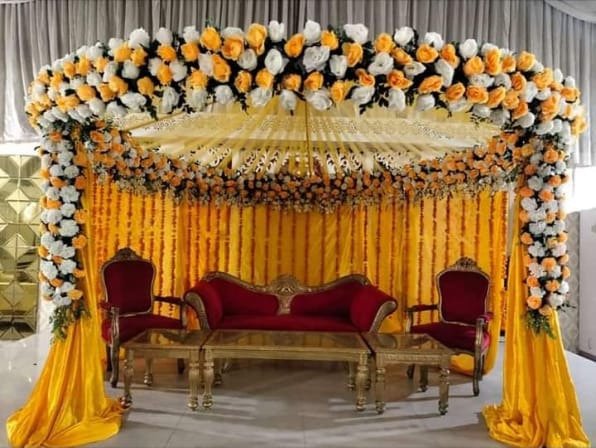 Orange mehndi stage decoration in Sialkot – Events In Sialkot