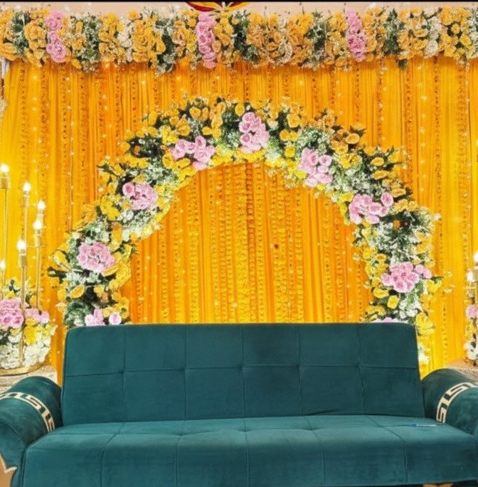 Orange and gold mehndi stage decoration in Sialkot – Events In Sialkot