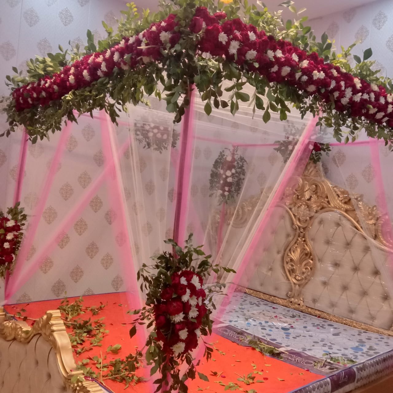 Red and orange bridal room flower canopy in Sialkot – Events In Sialkot