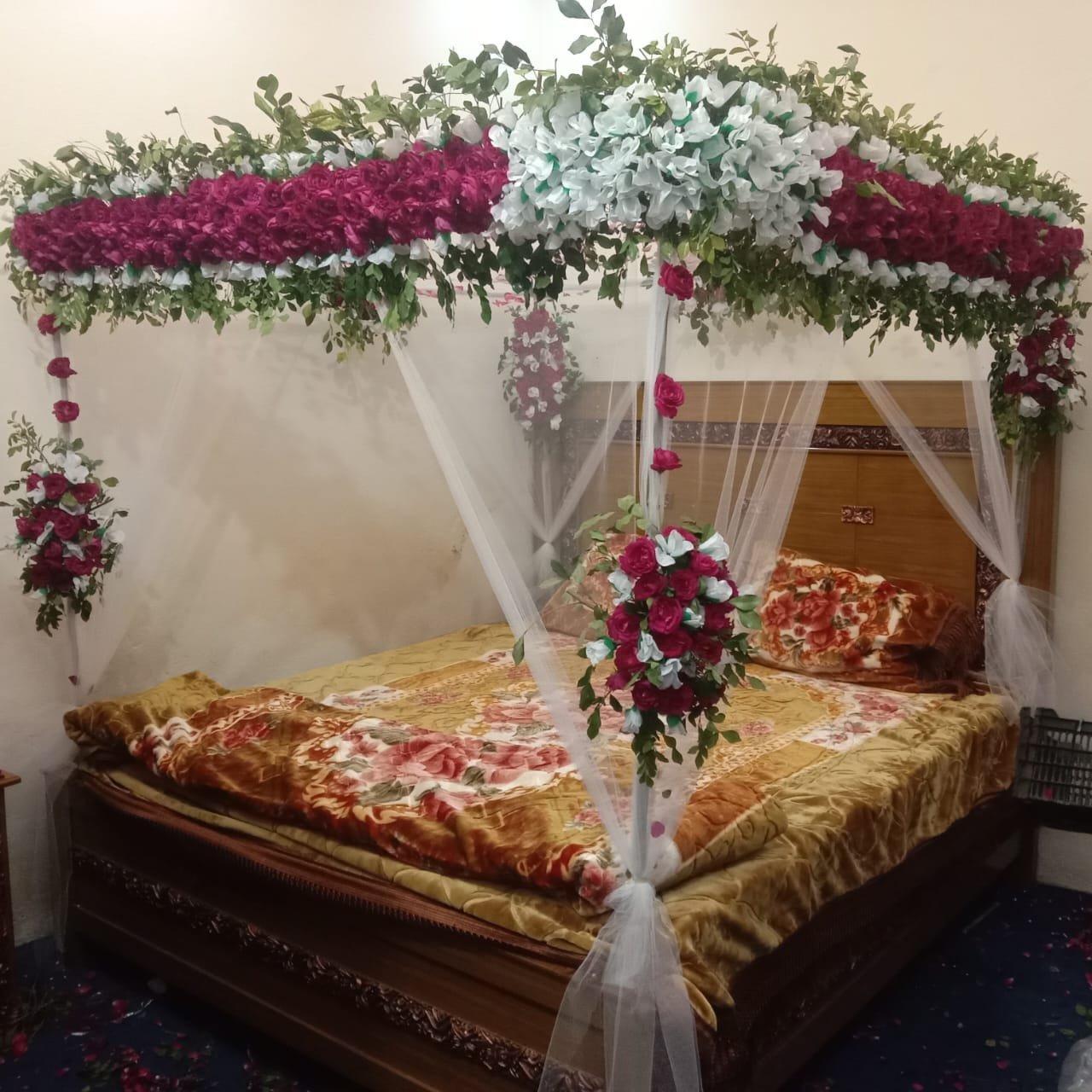 White and orange bridal room flower canopy in Sialkot – Events In Sialkot