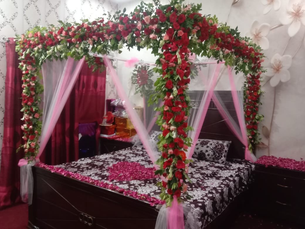 Maroon and white bridal room flower canopy in Sialkot – Events In Sialkot