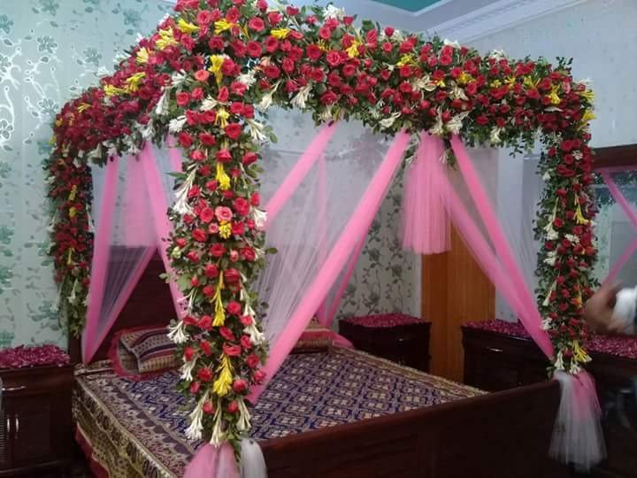 Maroon and pink bridal room flower canopy in Sialkot – Events In Sialkot