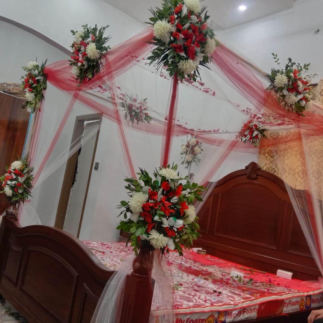 Red and maroon bridal room flower canopy in Sialkot – Events In Sialkot