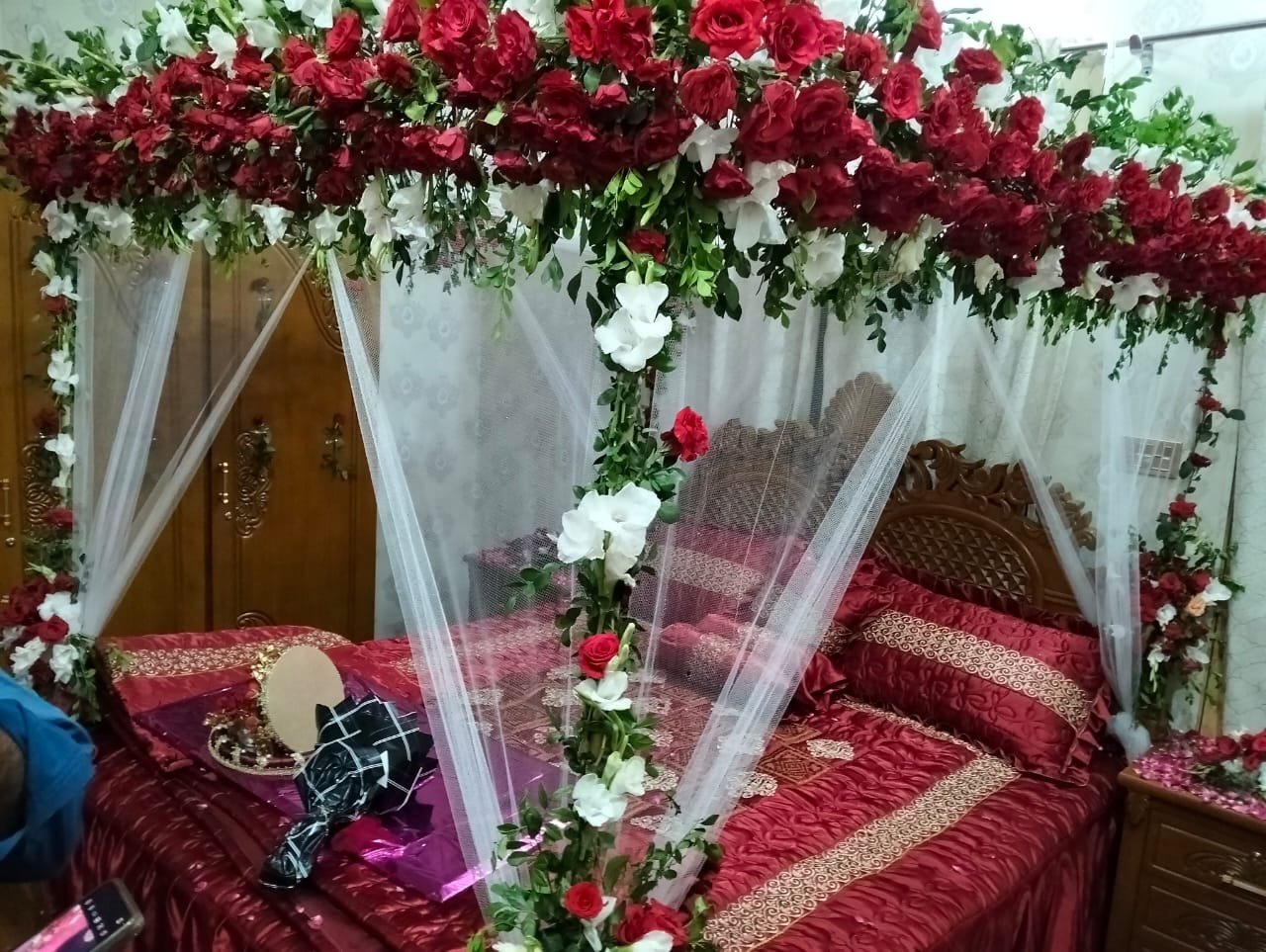Maroon and red bridal room flower canopy in Sialkot – Events In Sialkot
