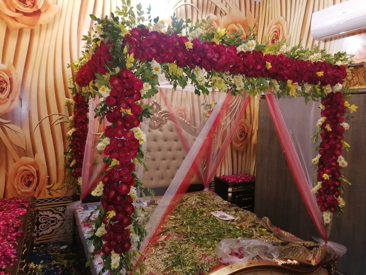 Maroon and orange bridal room flower canopy in Sialkot – Events In Sialkot