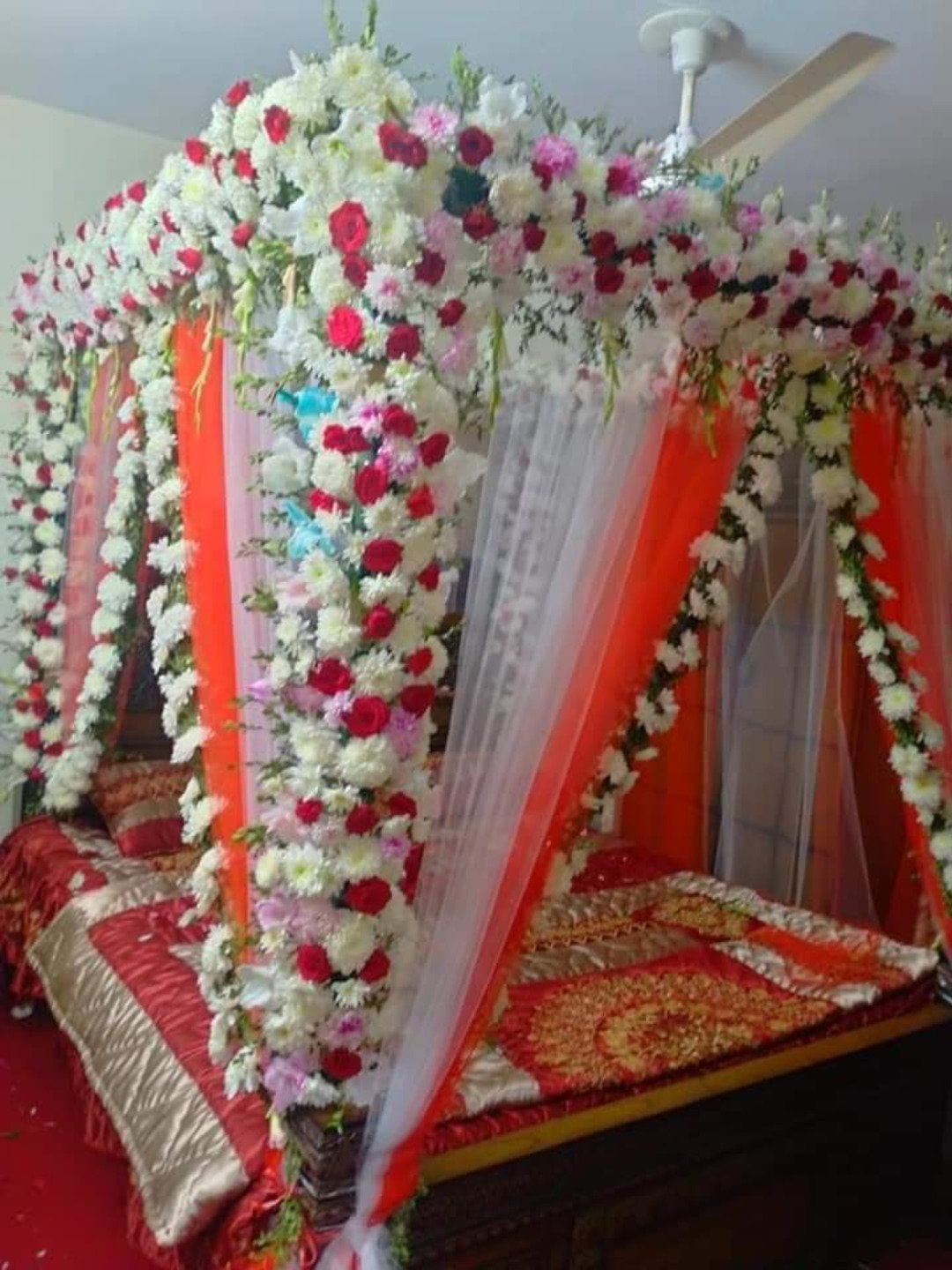 Maroon and red bridal room flower canopy in Sialkot – Events In Sialkot