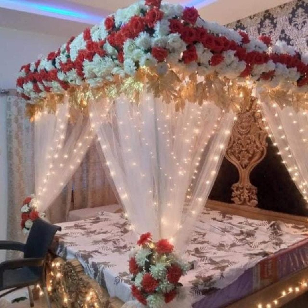 Orange and maroon bridal room flower canopy in Sialkot – Events In Sialkot