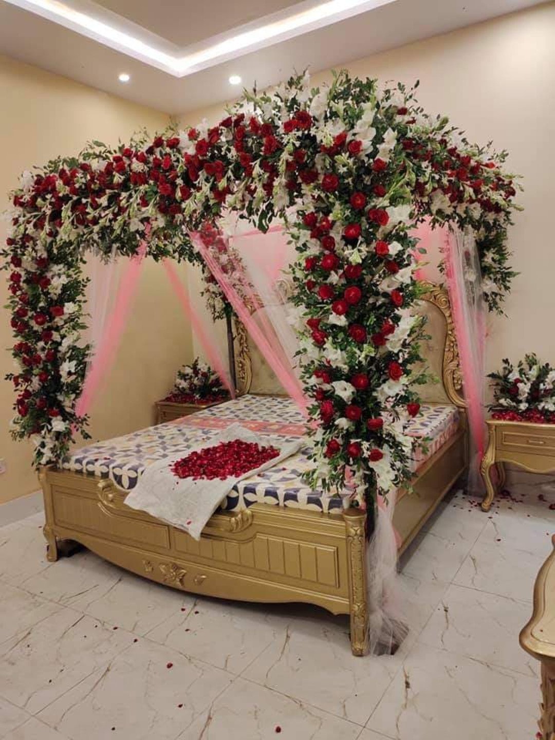 Maroon and orange bridal room flower canopy in Sialkot – Events In Sialkot