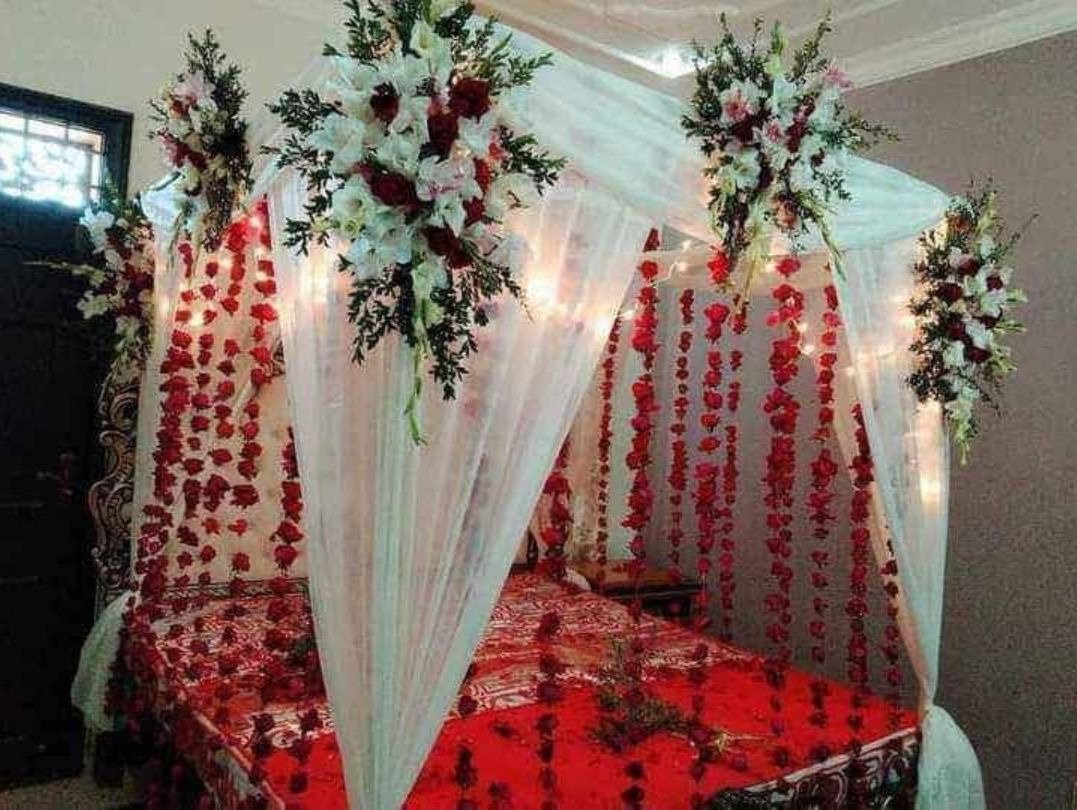 Maroon and red bridal room flower canopy in Sialkot – Events In Sialkot
